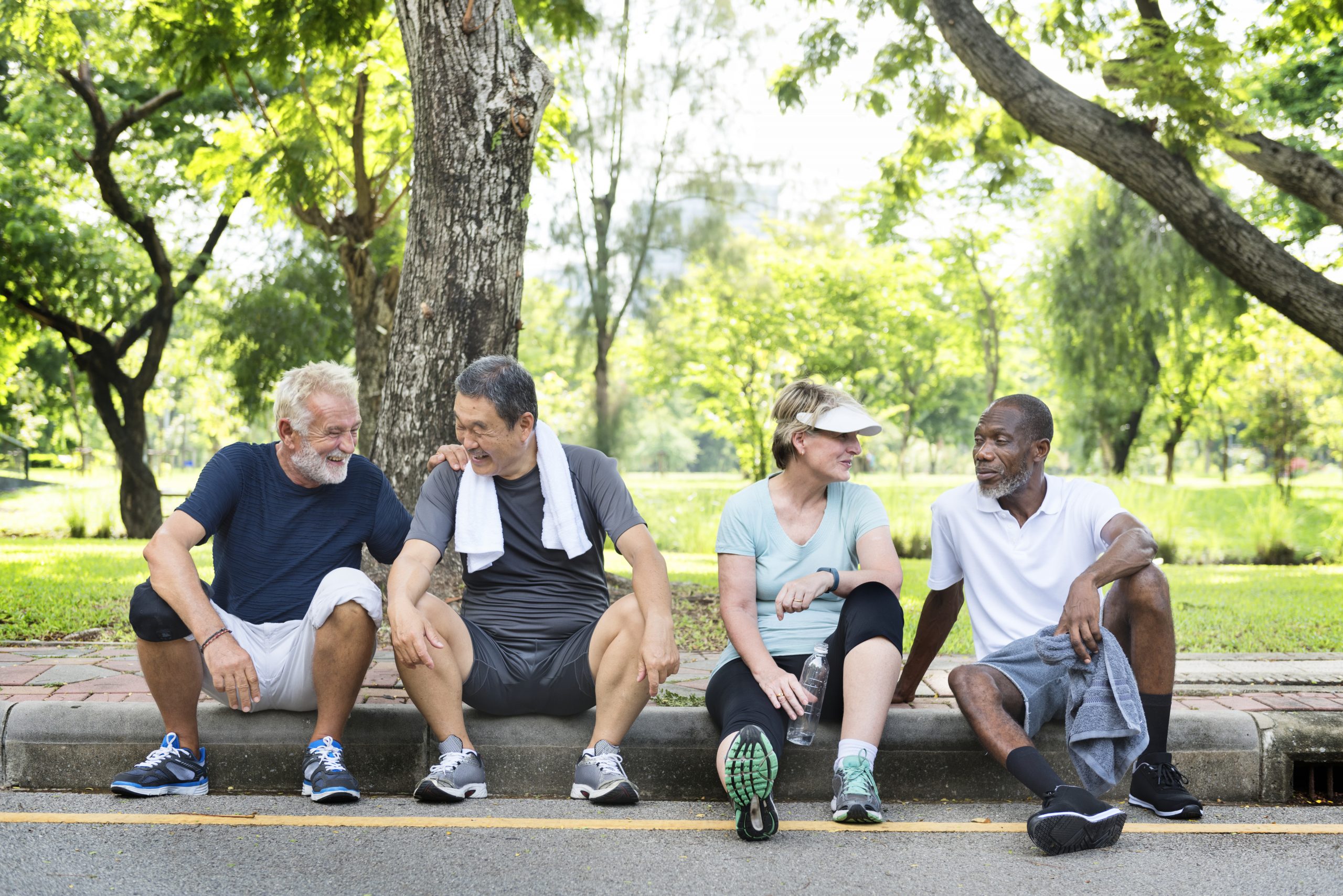 Group of senior friends relaxing together after an excercise